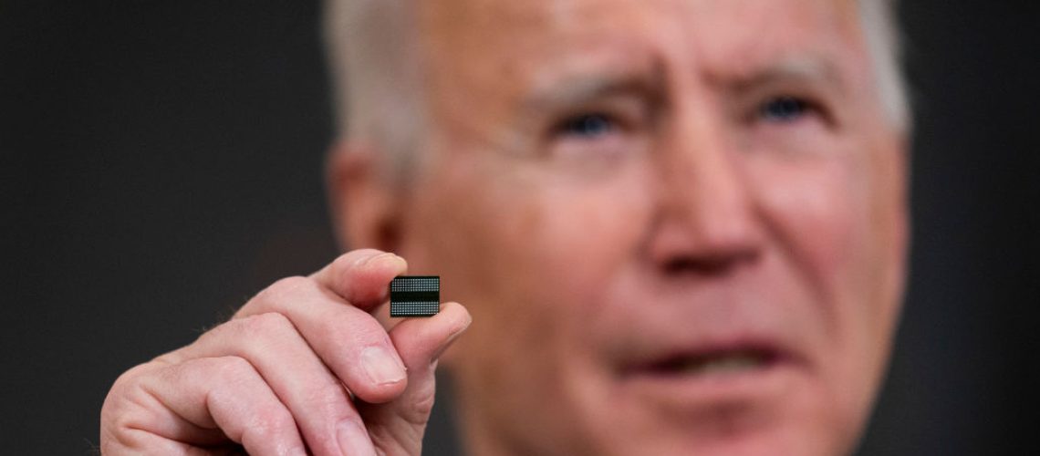 President Joe Biden displays a semiconductor during a White House press conference, February 24, 2021. (Doug Mills / Pool / Getty Images)